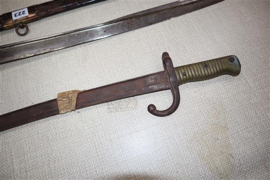 Two officers swords and a bayonet